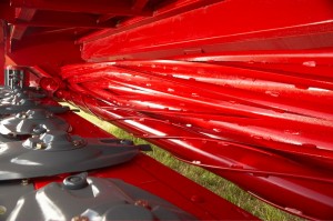 Under the header: an up-close look at the conditioning bars on the Hesston® by Massey Ferguson windrowers.