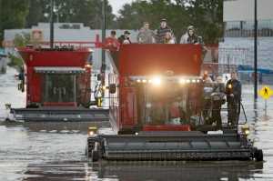 Farmway personnel waded through waist-deep floodwaters to three Massey Ferguson combines.