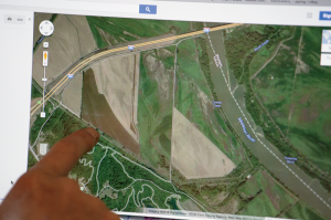 Edwards shows a satellite map he’s used for land research.
