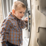 Jason's son Chase "checks" the equipment before it heads to the fields.